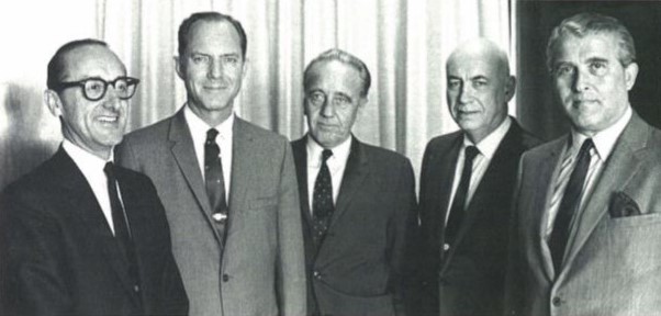 Senior NASA management assembled for the Apollo 9 Flight Readiness Review at NASA’s Kennedy Space Center (KSC): Associate Administrator for Manned Flight George E. Mueller, left, Apollo Program Director Samuel C. Phillips, KSC Director Kurt H. Debus, MSC Director Robert R. Gilruth, and Marshall Space Flight Center Director Wernher von Braun