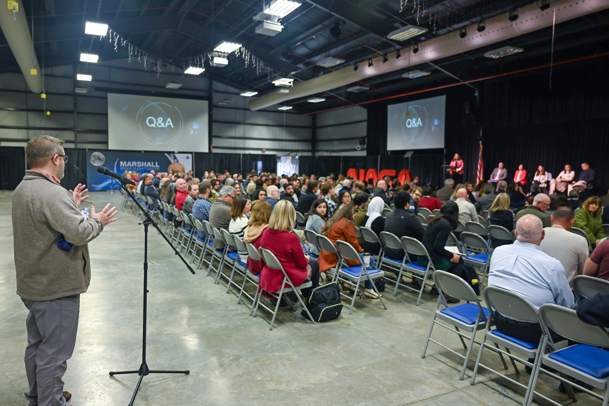 Brandon Phillips, a material science engineer, asks a question during the Q&A portion of the all-hands meeting.