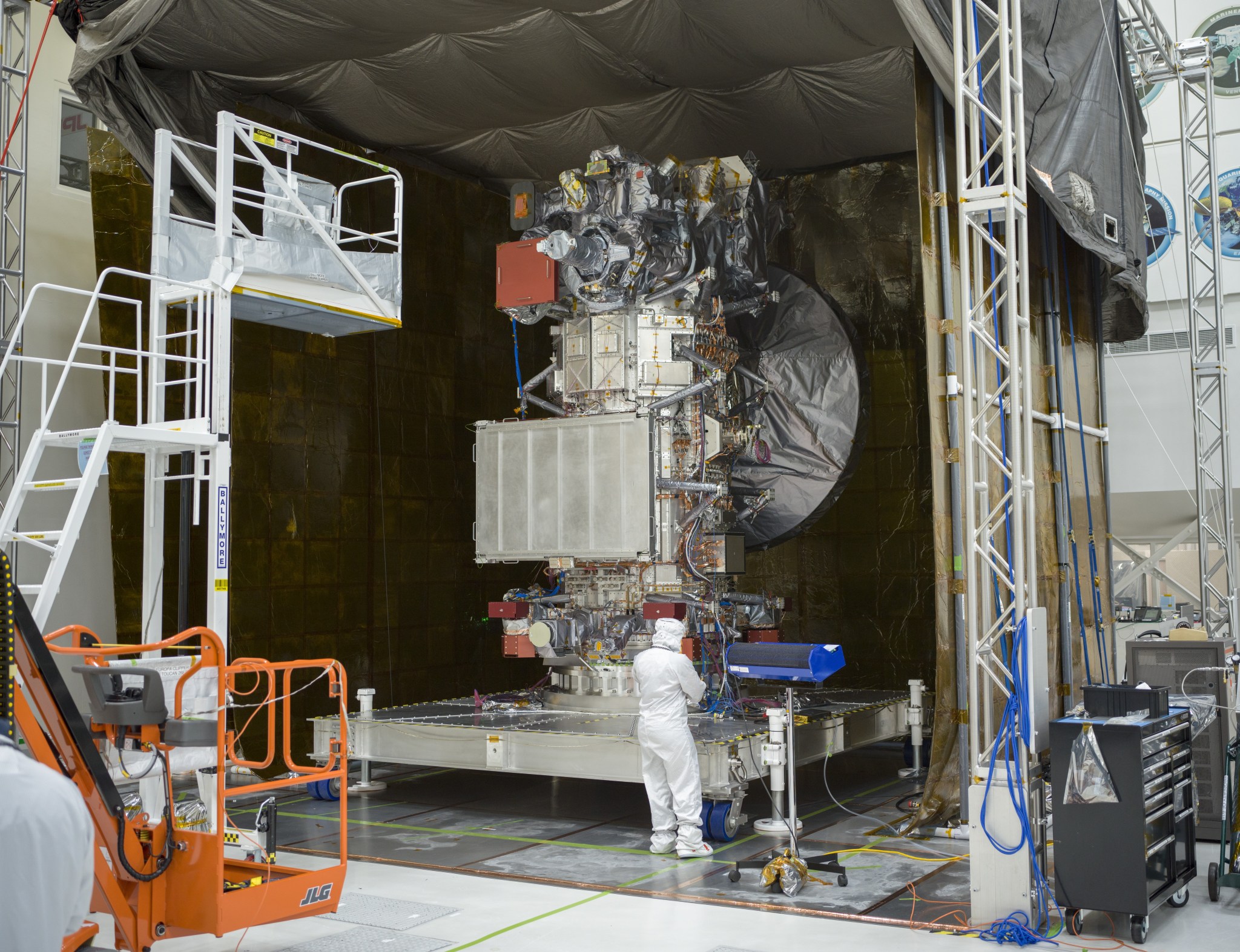 NASA’s Europa Clipper, with all of its instruments installed, is visible in the clean room of High Bay 1 at the agency’s Jet Propulsion Laboratory on Jan. 19. The tent around the spacecraft was erected to support electromagnetic testing.