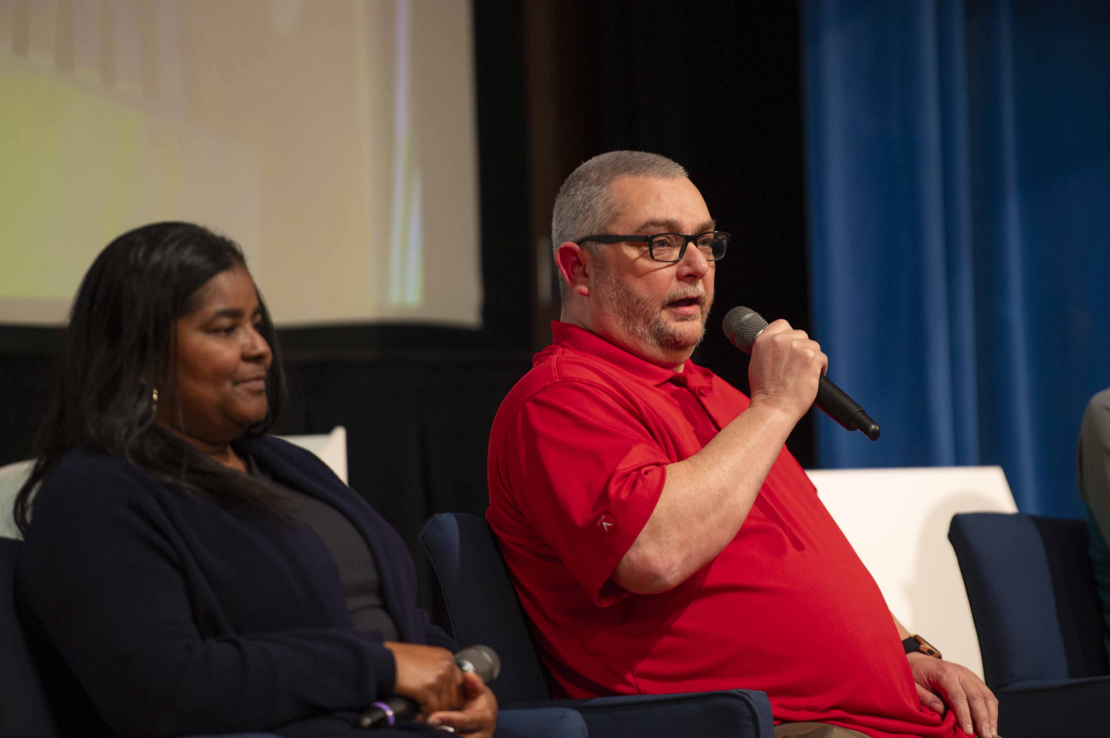 NASA controls engineer Dewayne Lavigne, seated on the right, speaks on how computer science field