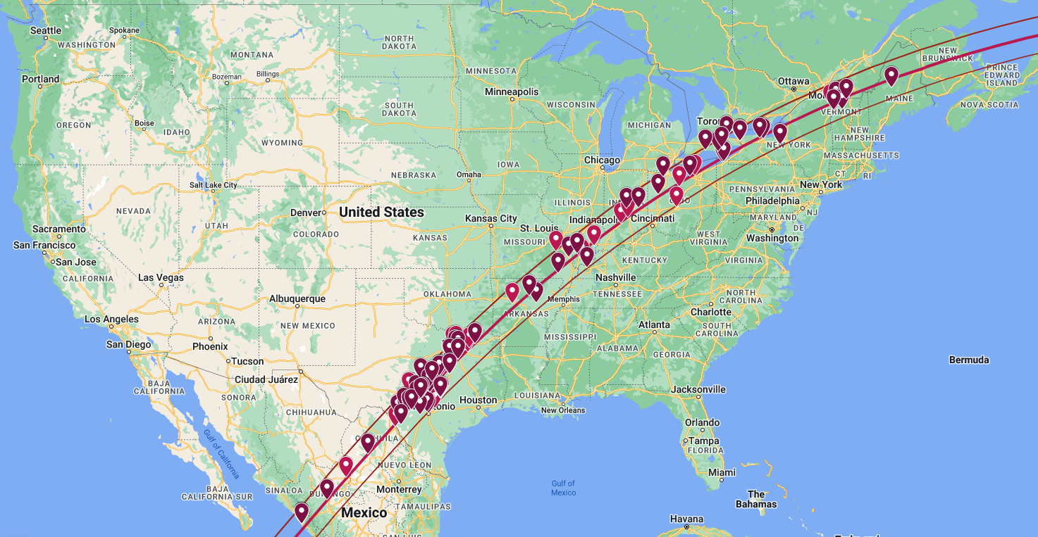 A map of North America, primarily showing the United States. There is a line that crosses from Mexico, into Texas, across the U.S. until Maine, and exits into the ocean off the coast of Canada. There are many red markers along that path indicating the locations of Eclipse Megamovie participants.