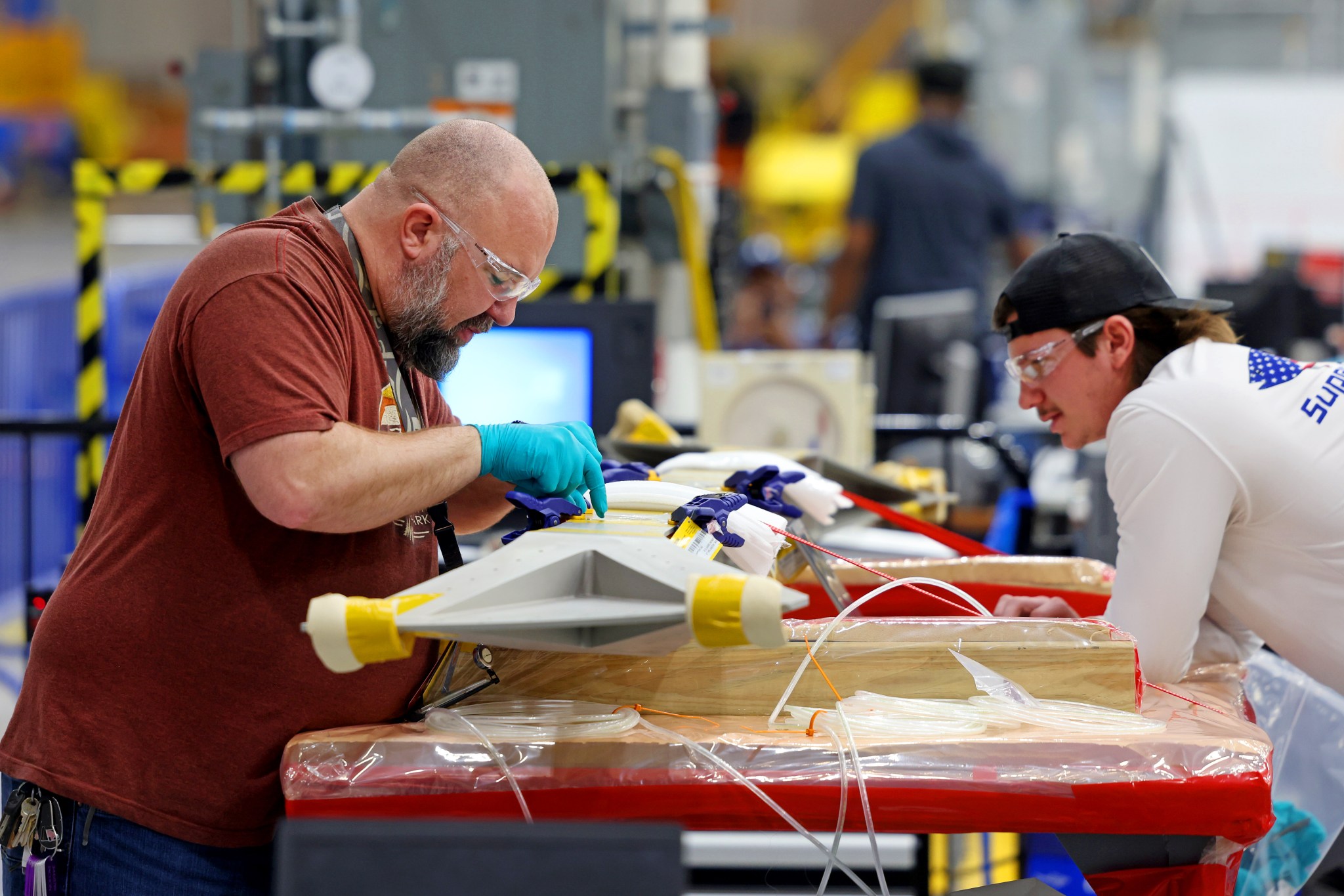 : Technicians at NASA’s Michoud Assembly Facility in New Orleans on Feb. 22 prepare elements that will form part of the midbody for the exploration upper stage. The midbody struts, or V-struts, will create the cage-like outer structure of the midbody that will connect the upper stage’s large liquid hydrogen tank to the smaller liquid oxygen tank. Manufacturing flight and test hardware for the future upper stage is a collaborative effort between NASA and Boeing, the lead contractor for EUS and the SLS core stage.