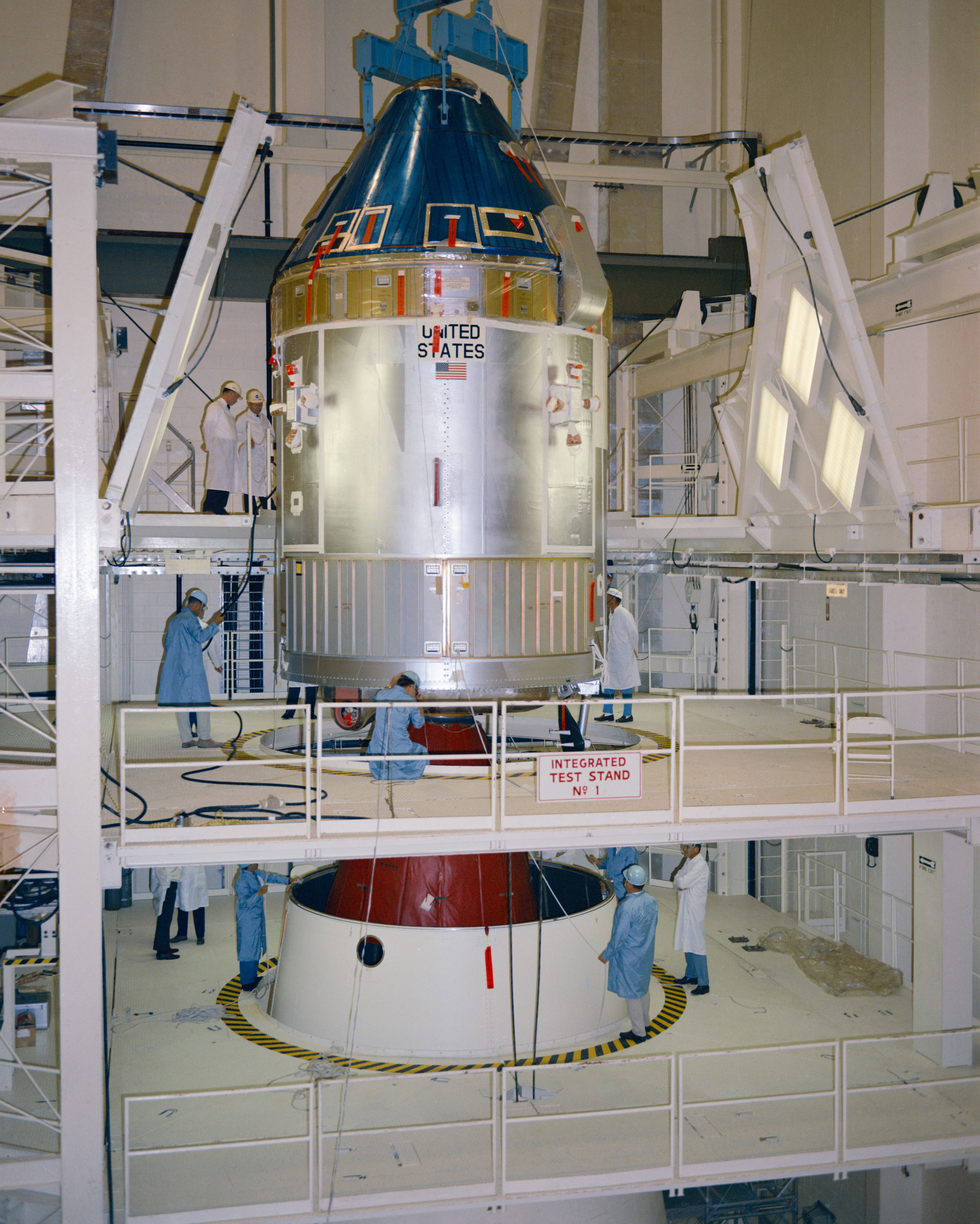 In the MSOB, workers lower the Command Service Module onto the Spacecraft LM Adaptor