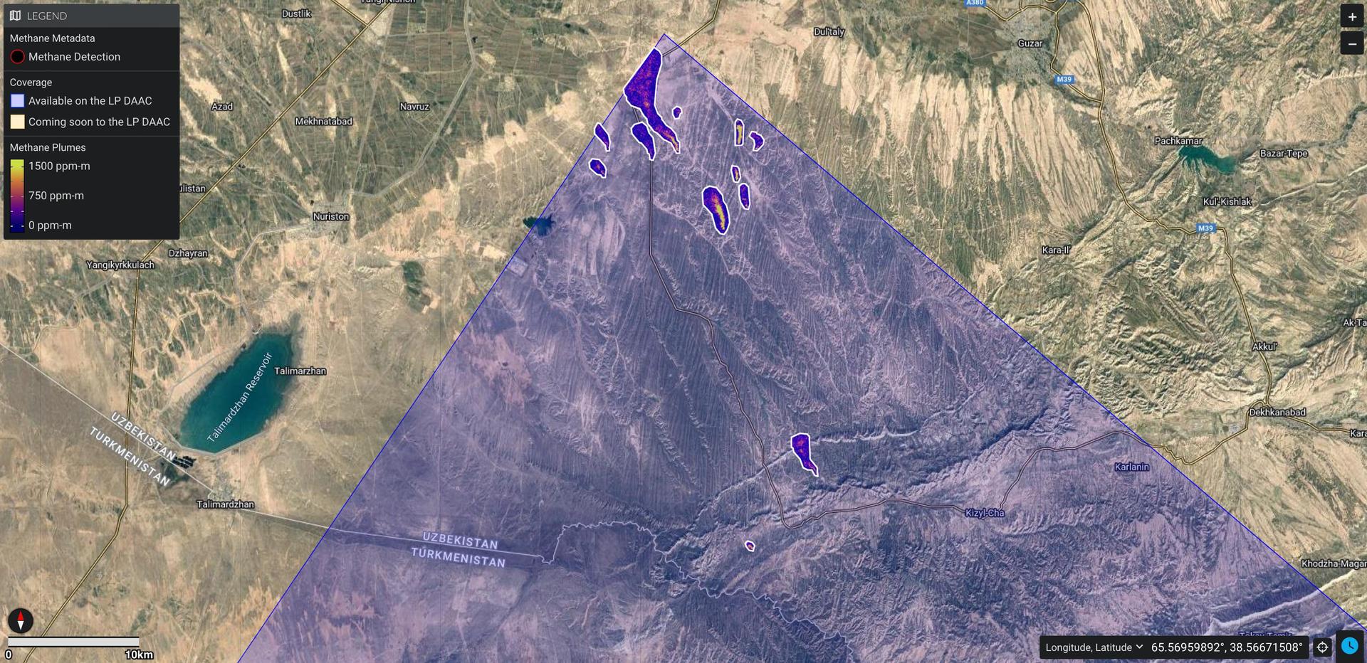 This image shows a large swath of land along the Uzbekistan/Turkmenistan border. A purple triangle covering the middle of the image is a 50-mile by 50-mile area captured by EMIT. There is one large purple plume near the bottom center and a cluster of plumes at the point of the triangle that are methane emissions.