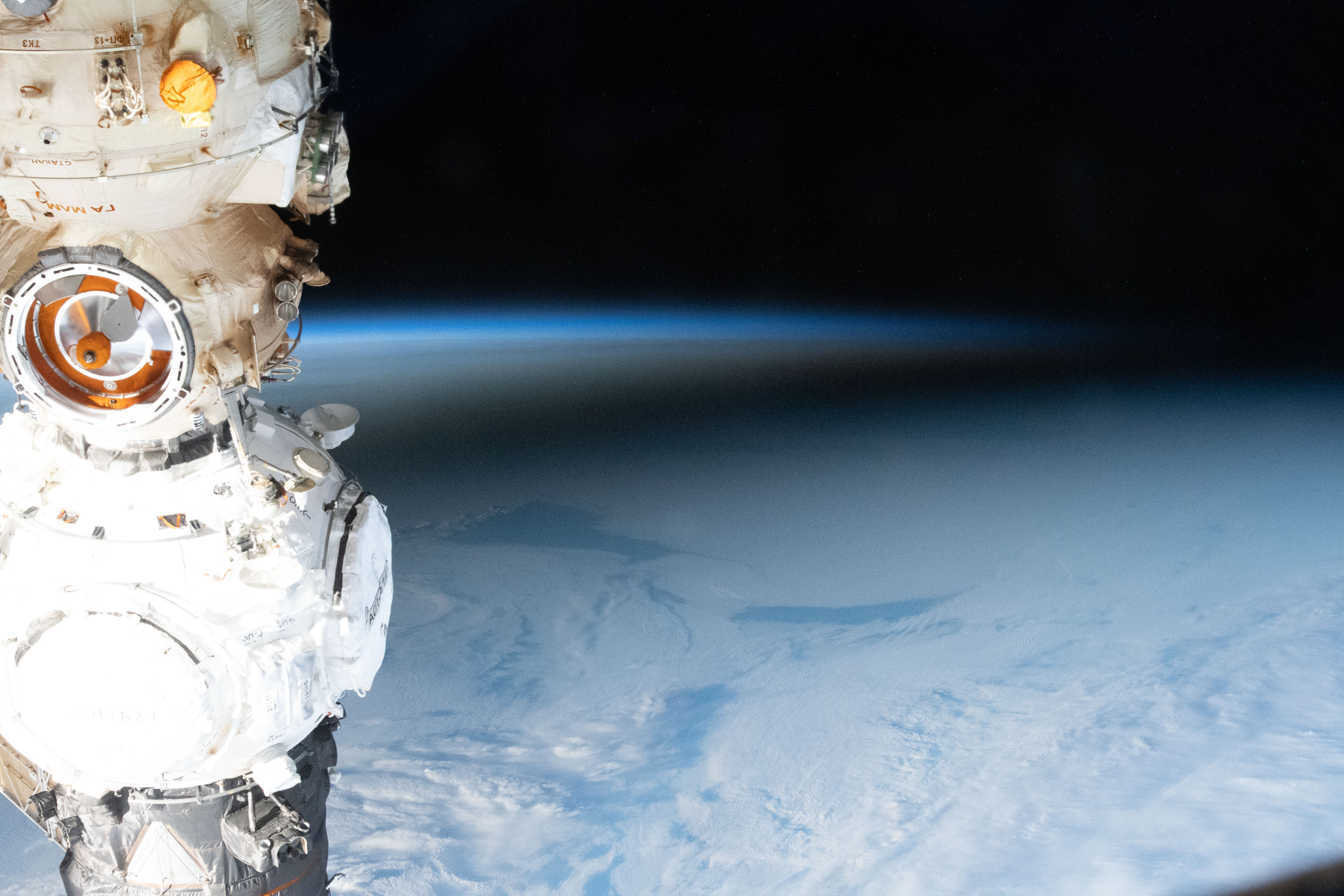 View of the eclipse over Antarctica in December 2021, from the Expedition 66 crew aboard the space station, left, and from the Deep Space Climate Observatory (DSCOVR) satellite