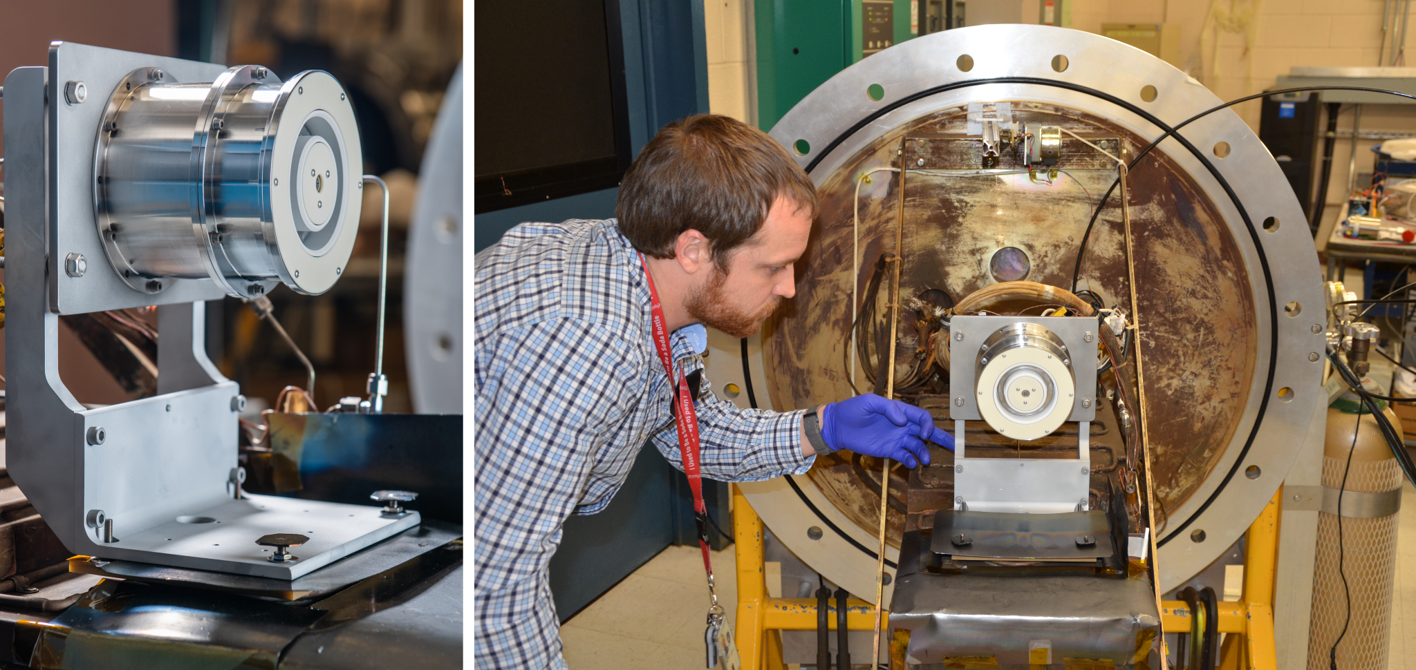 At left, a cylindrical metal device with an azimuthal white channel mounted on a metal support structure. On the right, an engineer touches the metal support structure with his left hand while closely watching how the metal device responds to a slight push.