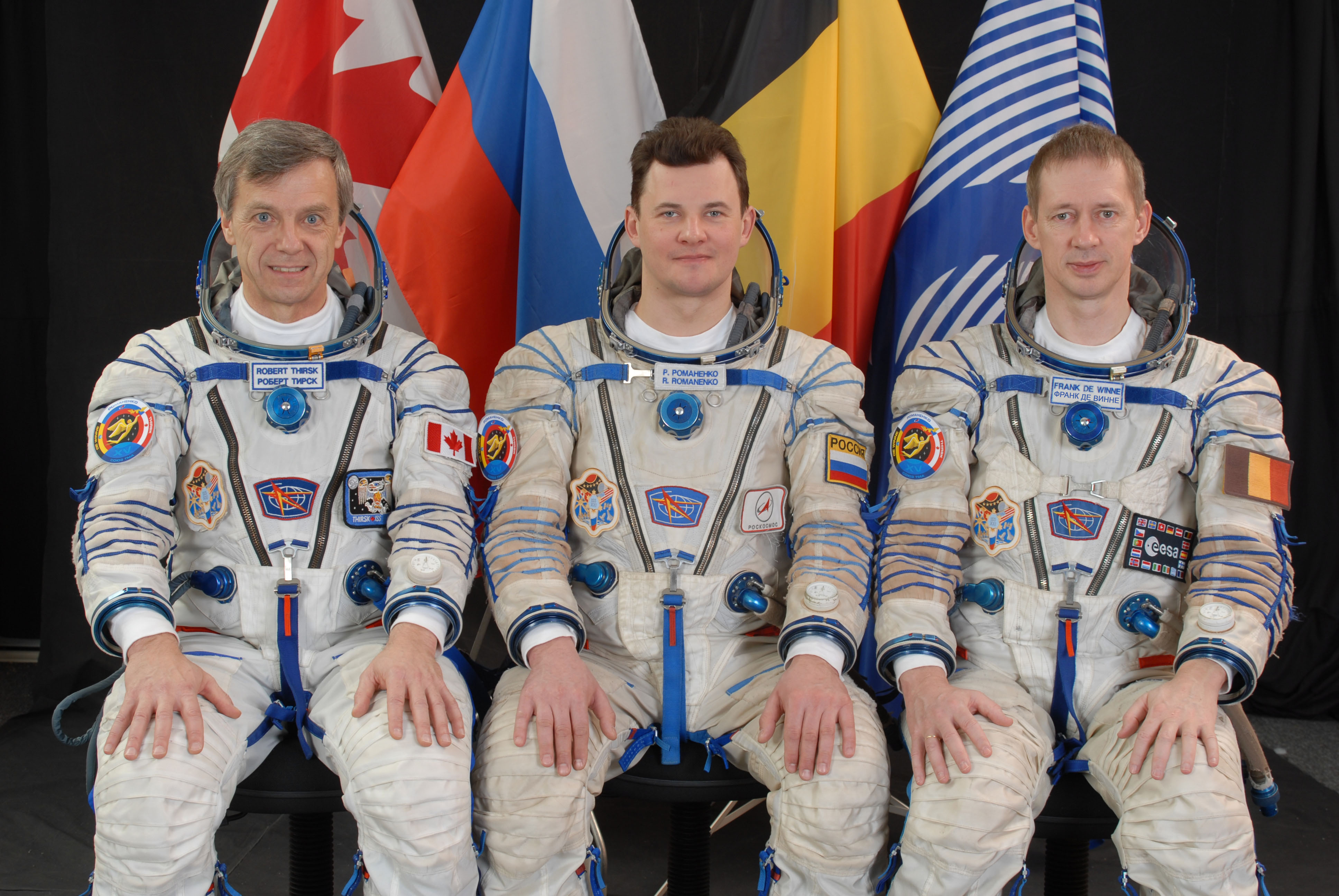 Canadian Space Agency astronaut Robert B. Thirsk, left, Roman Y. Romanenko of Roscosmos, and European Space Agency astronaut Frank L. DeWinne of Expedition 20