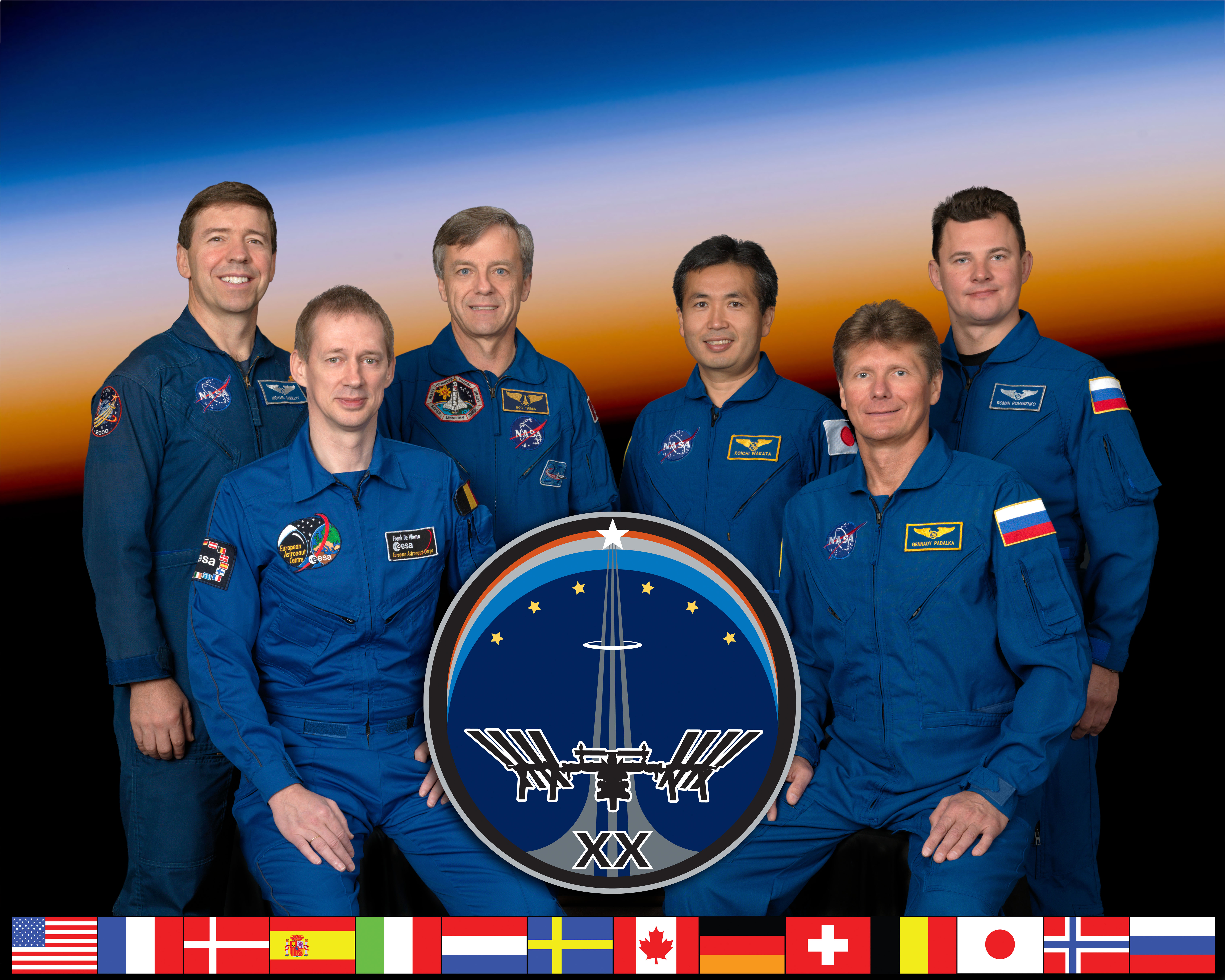 Preflight crew photo of Expedition 20, the first six-person crew on the space station – Michael M. Barratt (NASA), Frank L. DeWinne (ESA), Robert B. Thirsk (CSA), Koichi Wakata (JAXA), Gennadi I. Padalka (Roscosmos), and Roman Y. Romanenko (Roscosmos)