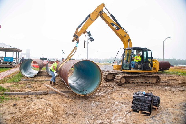 crew work on upgrade to water system near Fred Haise Test Stand