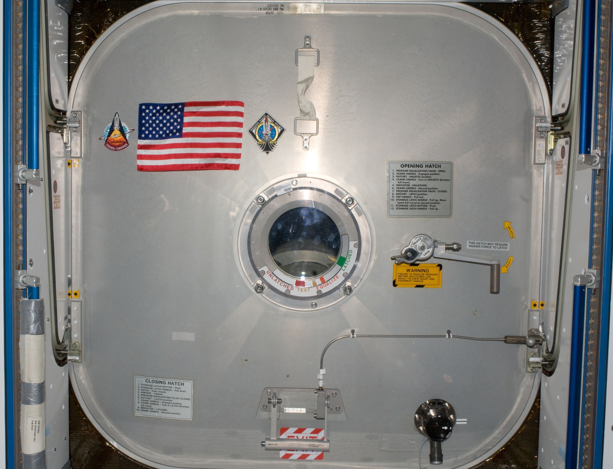 An American flag on the space station's forward hatch