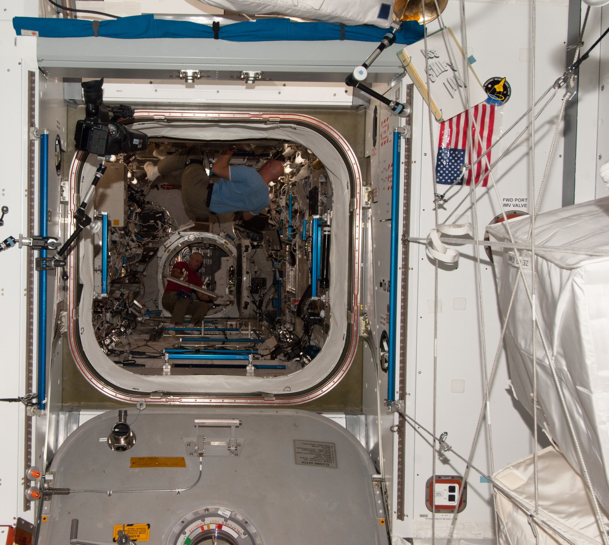 A photo looking down a hatch on the space station