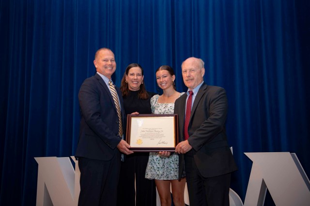 The family of NASA Stennis Director John Bailey accompanies him in a photo after he receives the Meritorious Senior Executive Presidential Rand Award