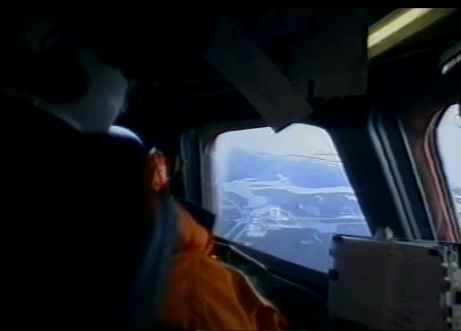 Robert D. Cabana pilots Columbia during the final approach to NASA’s Kennedy Space Center (KSC) in Florida, with the Vehicle Assembly Building visible through the window