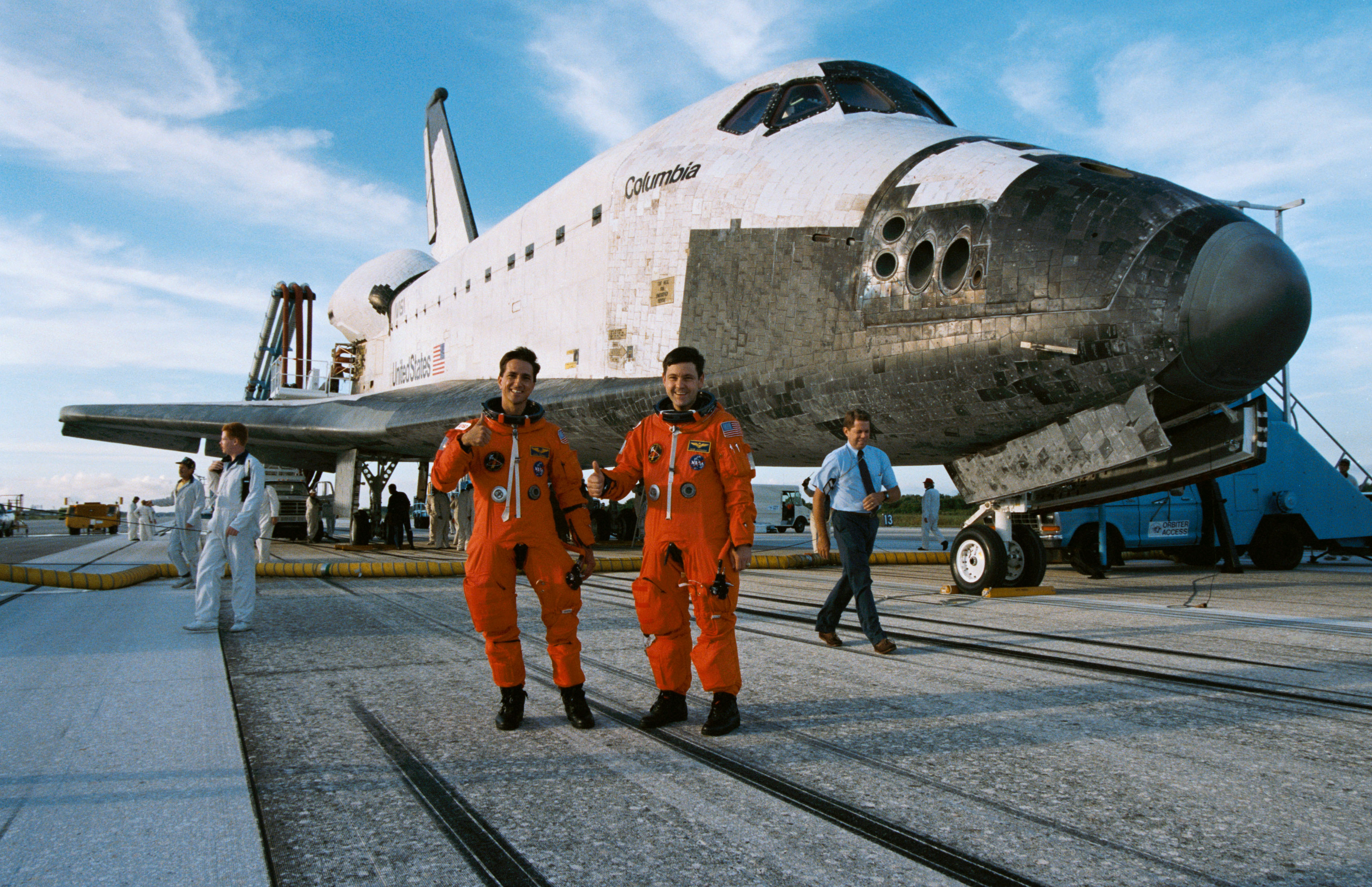 Donald A. Thomas, left, and Cabana give a thumbs up after the successful mission