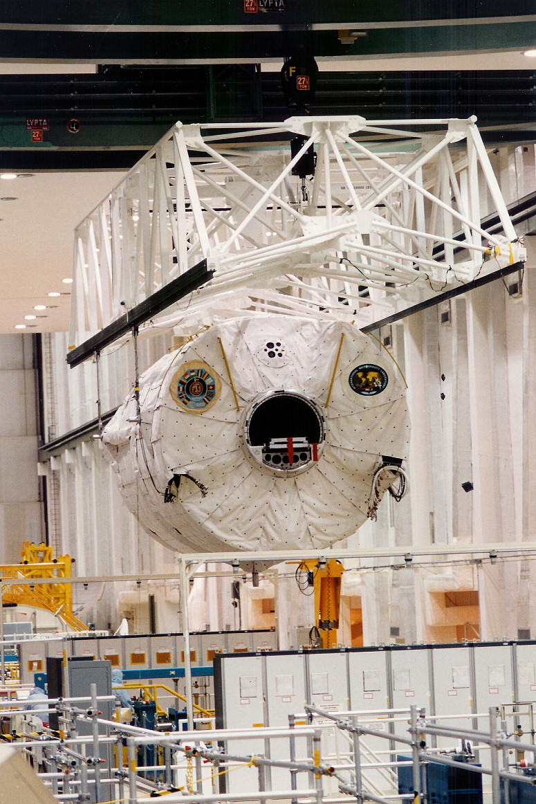 Workers at NASA’s Kennedy Space Center in Florida prepare the Spacelab module for the STS-65 mission