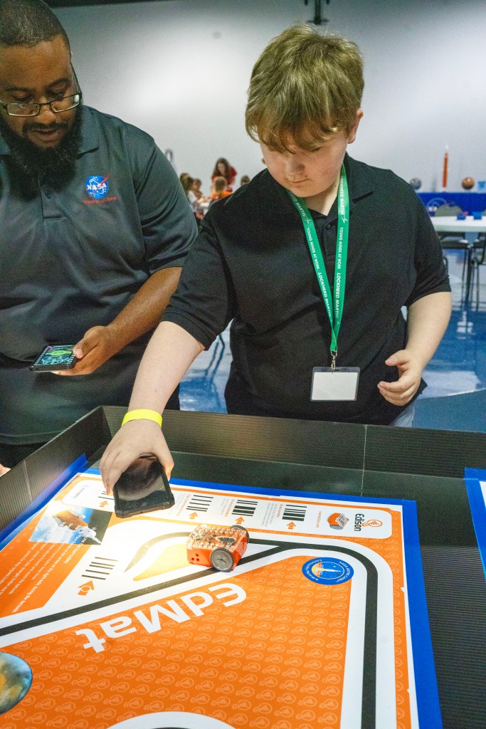 Danny Griffiin conducts an activity with a Take Our Children to Work Day participant