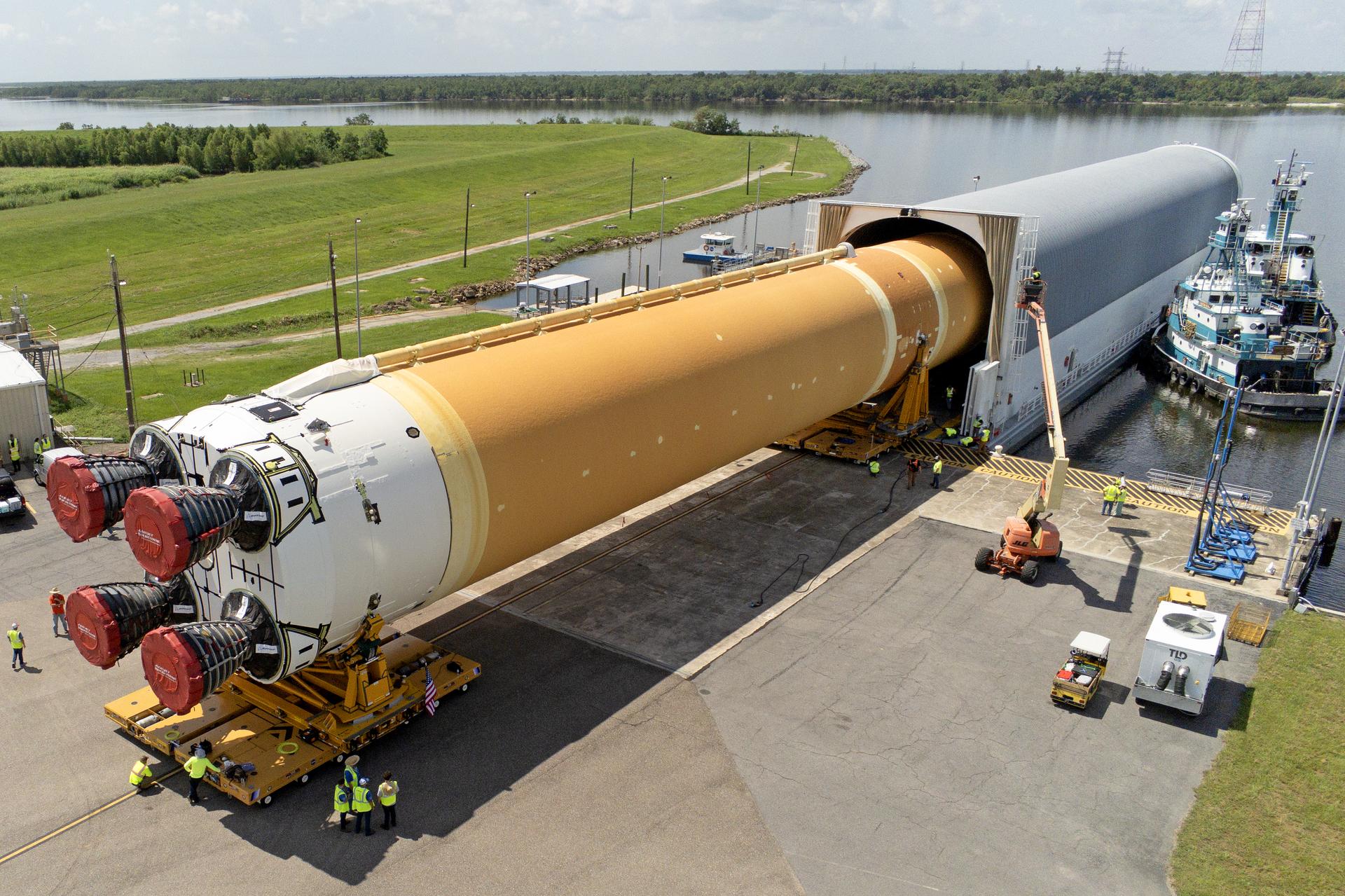 Team members at Michoud Assembly Facility load the first core stage that will help launch the first crewed flight of NASA’s SLS (Space Launch System) rocket for the agency’s Artemis II mission onto the Pegasus barge on July 16. The barge will ferry the core stage on a 900-mile journey from the agency’s Michoud Assembly Facility in New Orleans to its Kennedy Space Center in Florida.