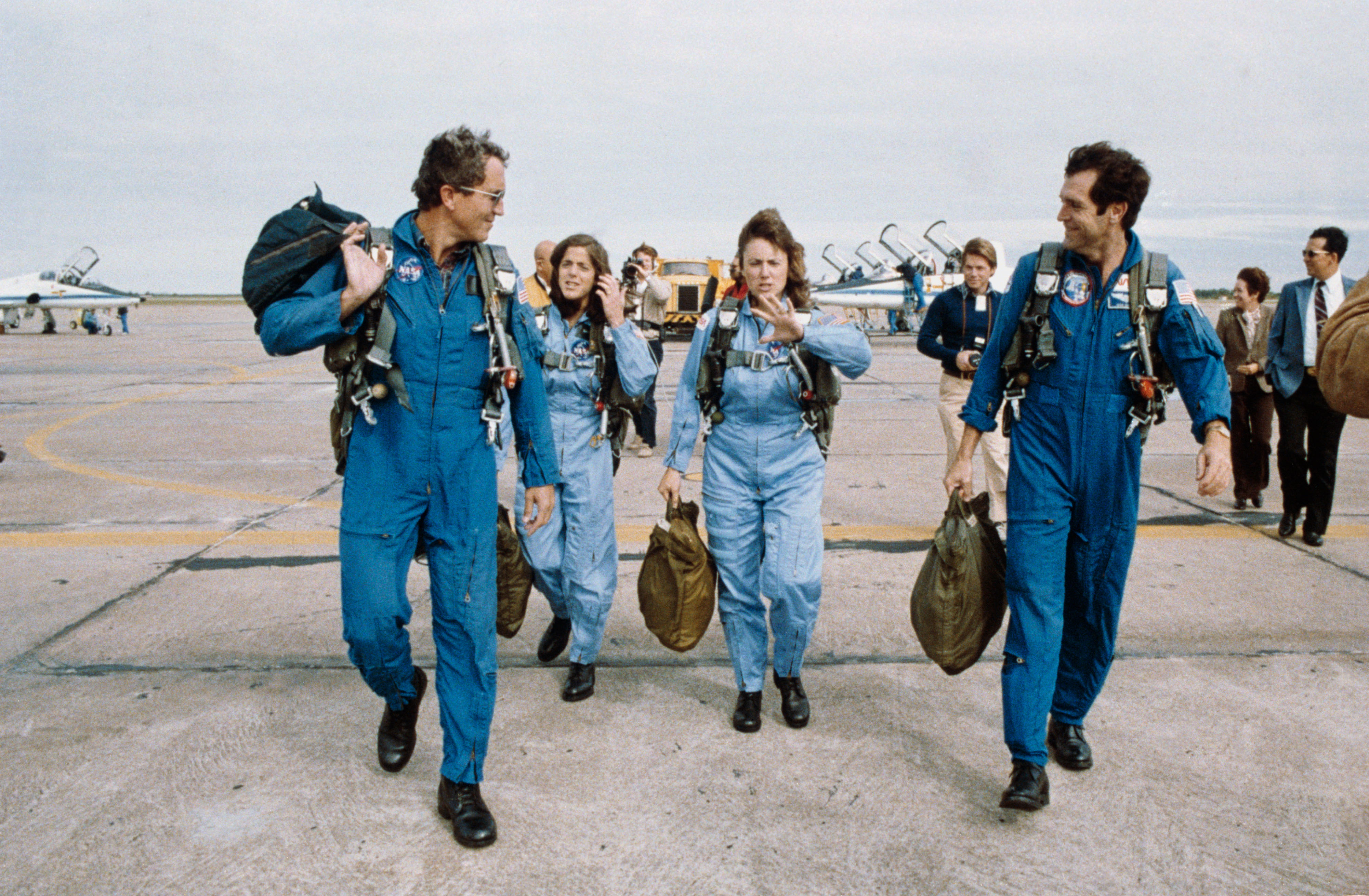 Michael J. Smith, left, Barbara R. Morgan, McAuliffe, and Francis R. “Dick” Scobee following training flights aboard T-38 jets