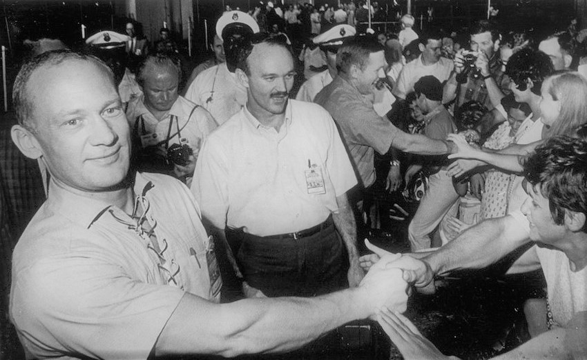 On Aug. 10, 1969, Buzz, left, Mike, and Neil exit the Lunar Receiving Laboratory at the Manned Spacecraft Center (MSC