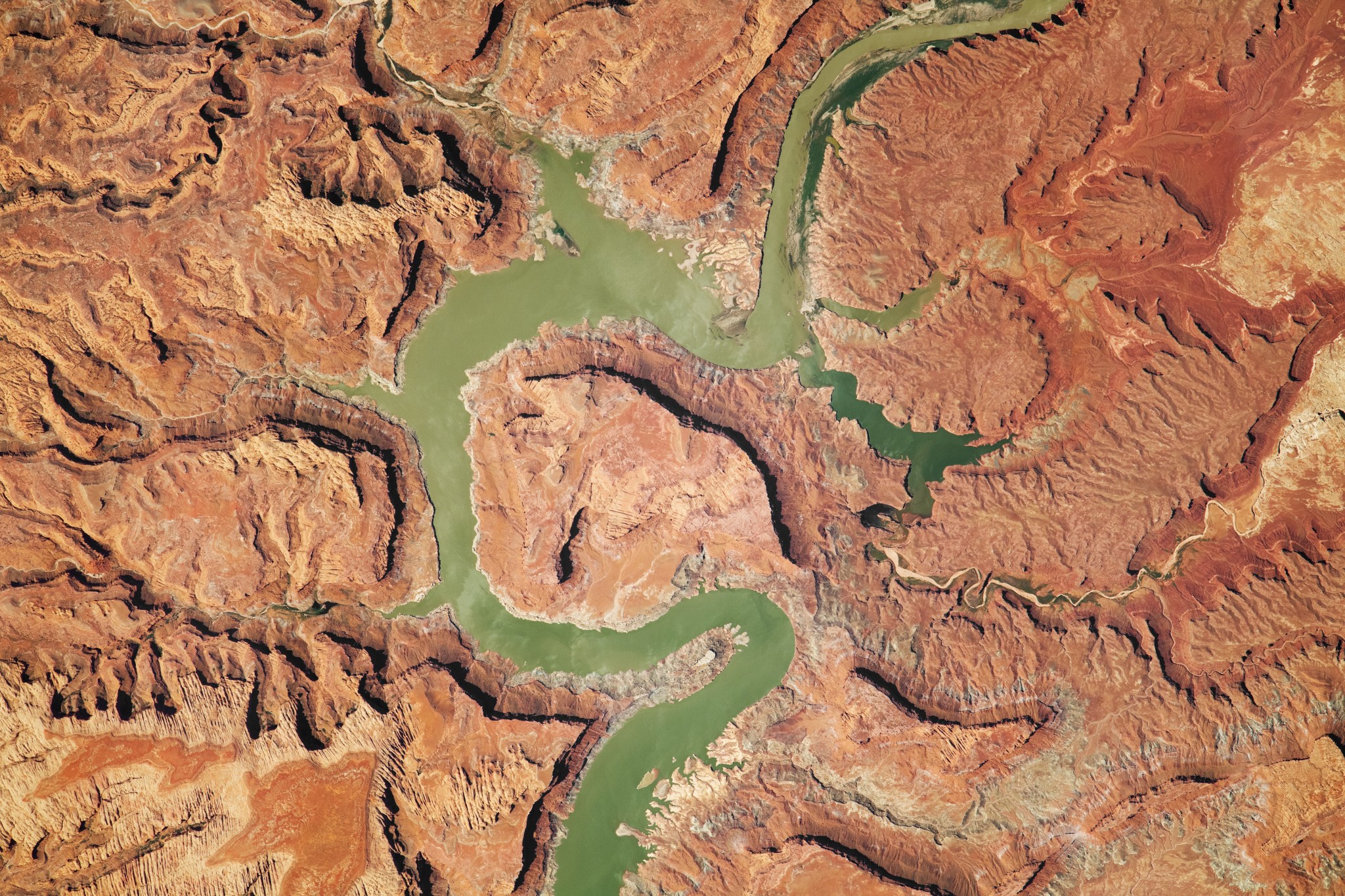 Erosion, tectonic uplift, and a human-built dam have all helped shape the Upper Lake Powell area in Utah.