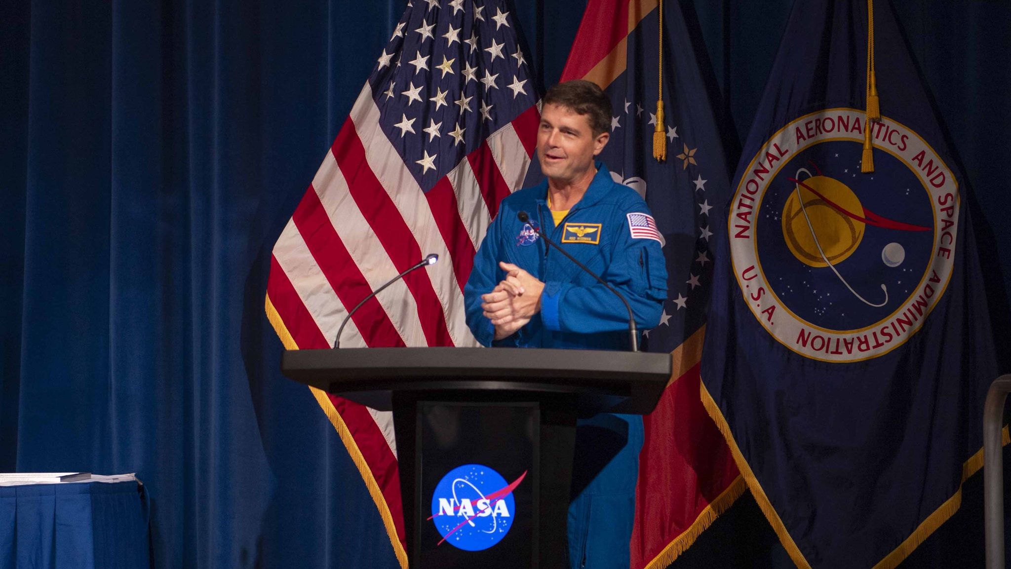 NASA astronaut Reid Wiseman addresses audience members at the Silver Snoopy Awards at Stennis Space Center