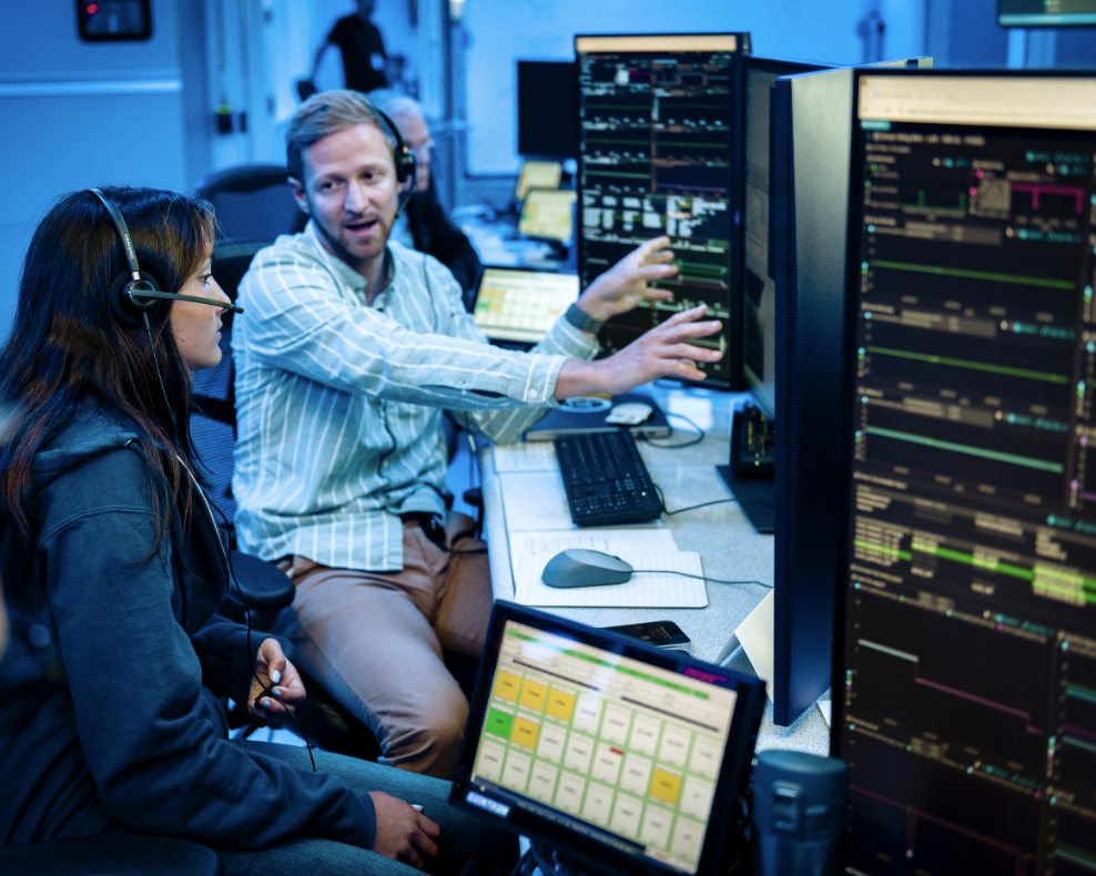 Arno Rogg explains the Volatiles Investigating Polar Exploration Rover (VIPER) mission to visitors in the Multi-Mission Operations Center (MMOC), N240, during VIPER Friends and Family Day.