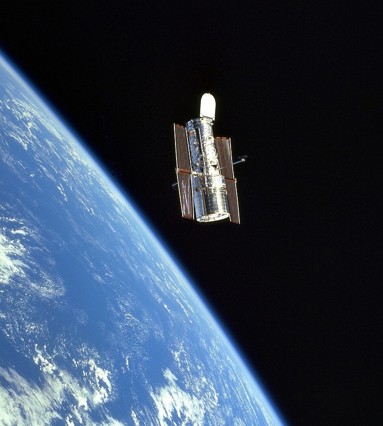 View of the Hubble Space Telescope against the limb of the Earth and black sky