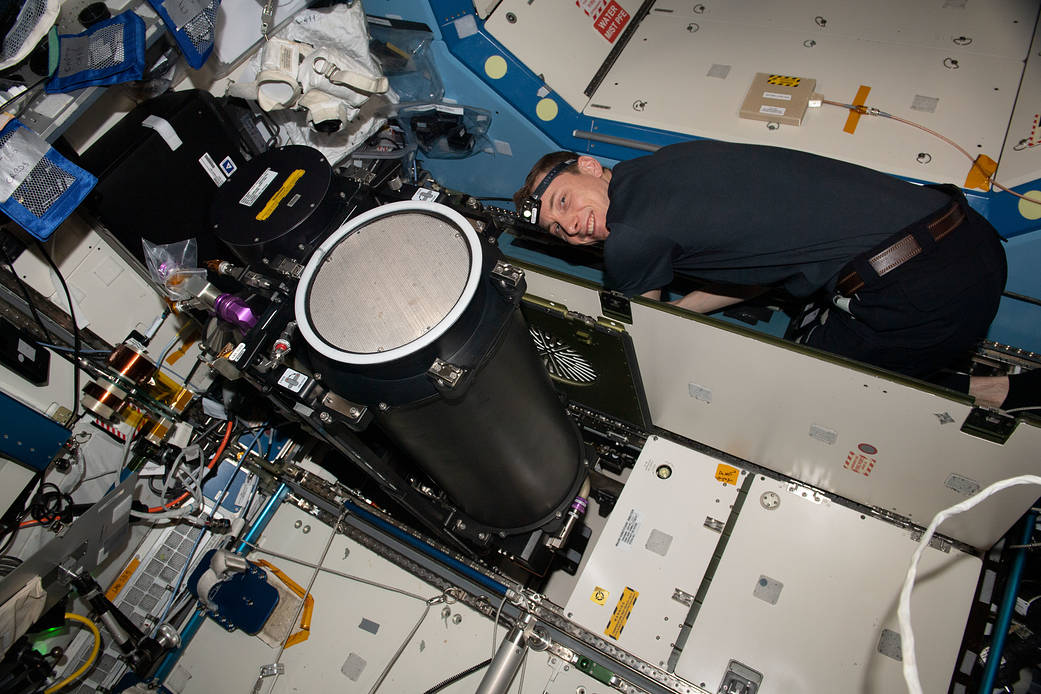 Astronaut Woody Hoburg replaces life support system components