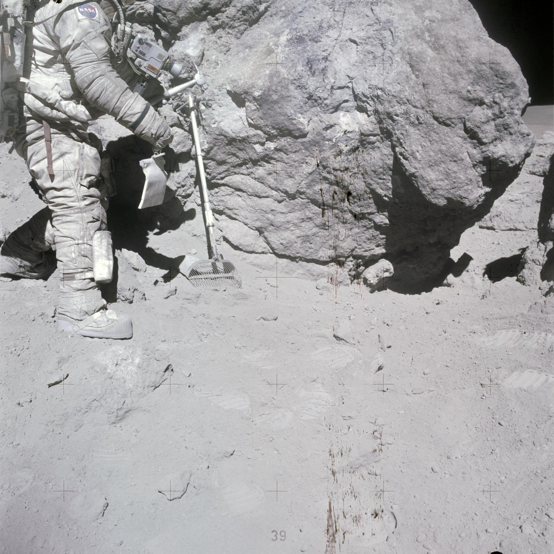 Charlie Duke on a lunar EVA collecting samples